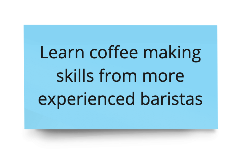 This is a pale blue rectangular card with black text that reads 'Learn coffee making skills from more experienced baristas.